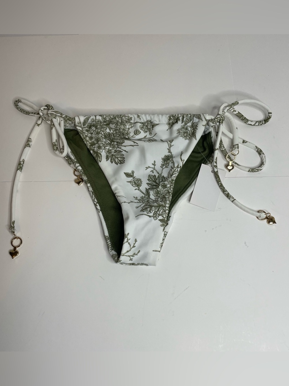 Heat Swimwear String Bikini Bottom Size  XS. White With Green Foliage. Flowers.